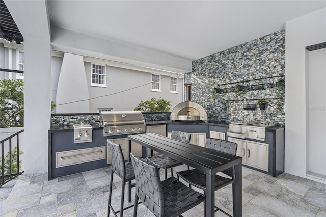 view of patio / terrace with an outdoor kitchen and grilling area