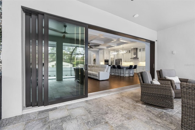 interior space with coffered ceiling and beam ceiling