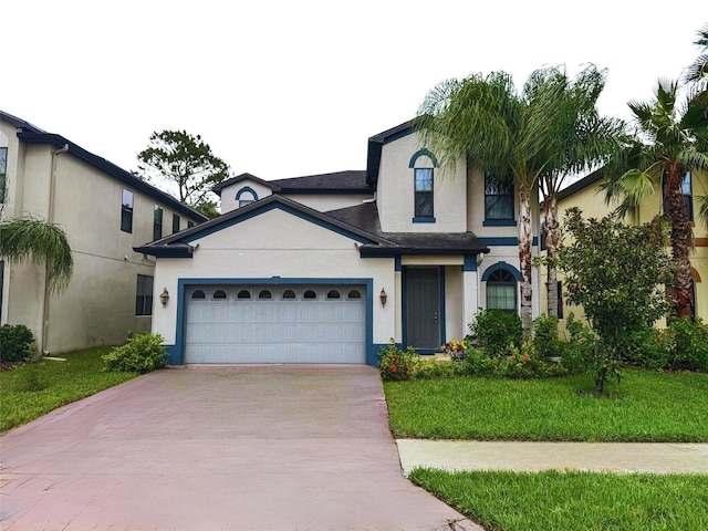 view of front facade featuring a garage and a front lawn