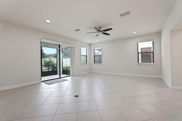 tiled empty room with ceiling fan