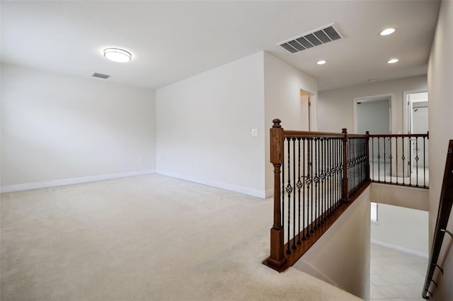 interior space featuring light colored carpet