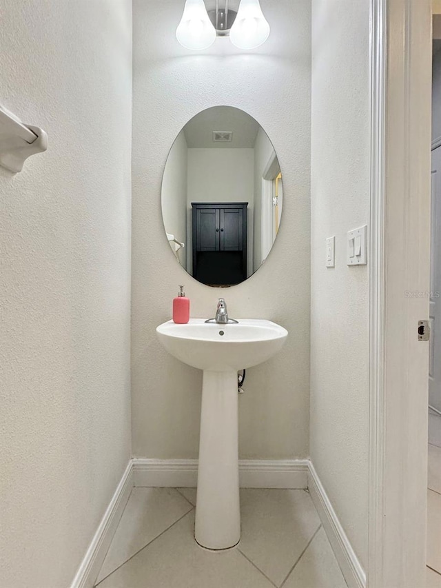 bathroom with tile patterned flooring