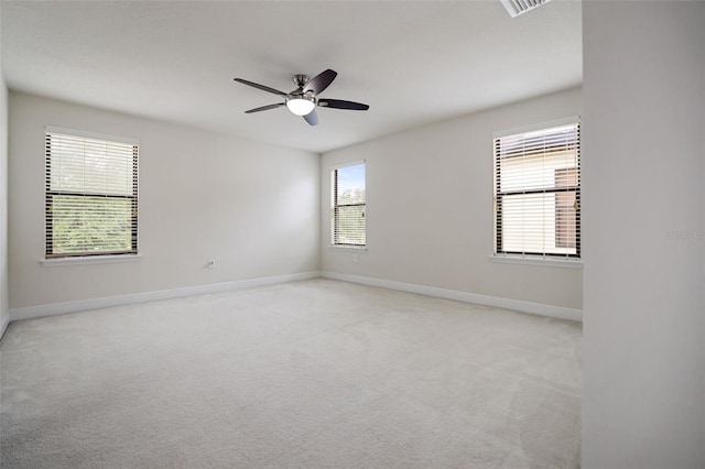 carpeted empty room featuring ceiling fan