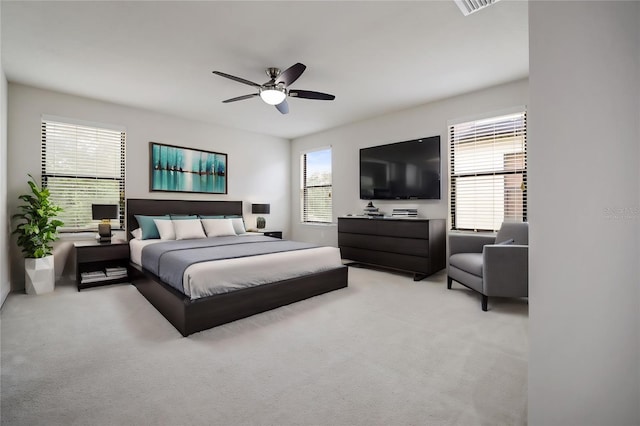 carpeted bedroom with ceiling fan