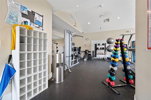 exercise room featuring high vaulted ceiling