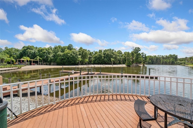 exterior space with a water view and a boat dock