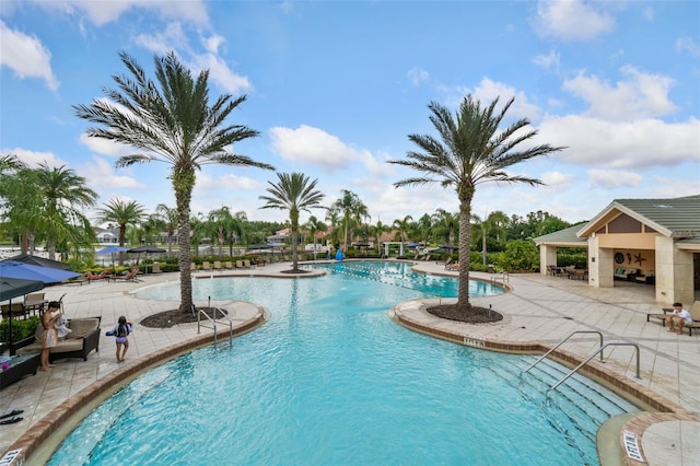 view of swimming pool featuring a gazebo and a patio