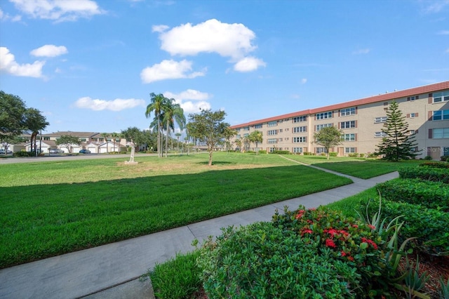 view of home's community featuring a yard