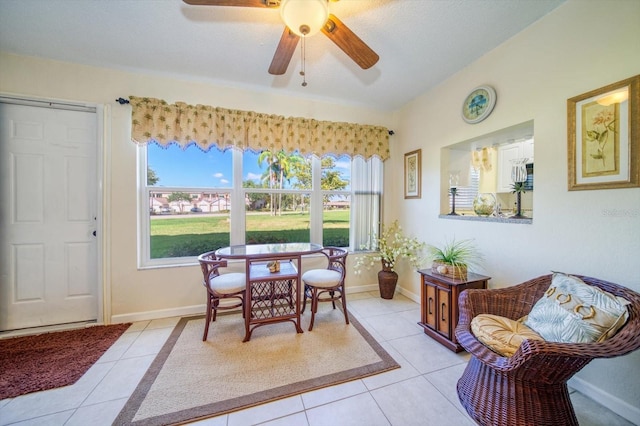 dining area with light tile patterned flooring and ceiling fan