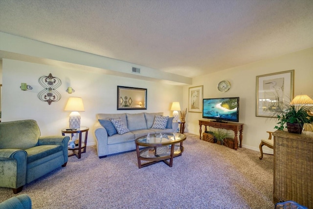 carpeted living room with a textured ceiling