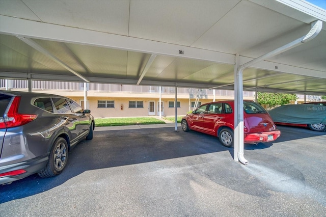 view of vehicle parking with a carport