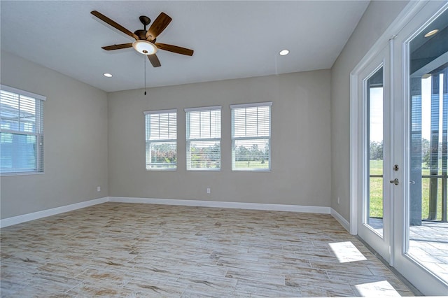 spare room featuring french doors and ceiling fan