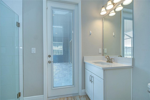 bathroom featuring vanity and a notable chandelier