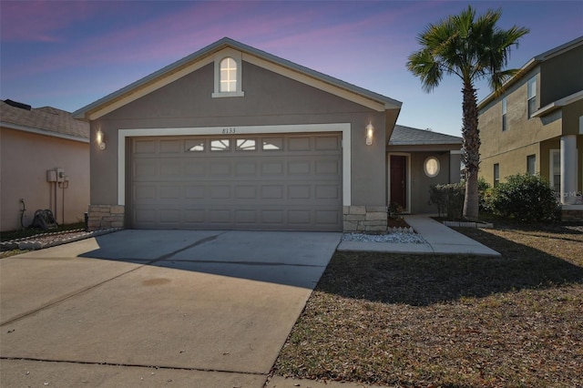 ranch-style house featuring a garage