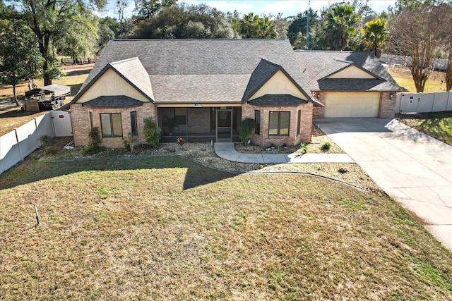 view of front of house featuring a garage and a front yard