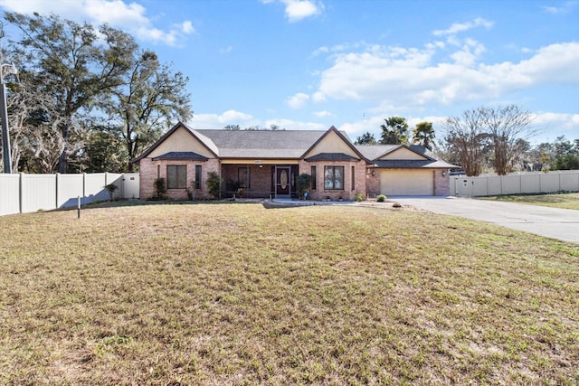 ranch-style house with a garage and a front yard