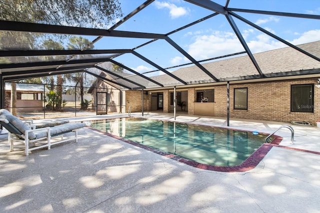 view of pool with a lanai and a patio