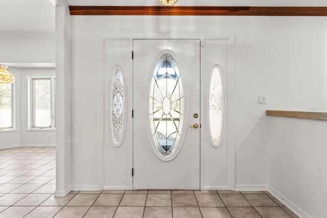 tiled foyer entrance with a wealth of natural light