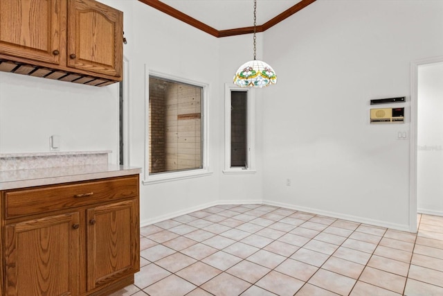 unfurnished dining area featuring ornamental molding