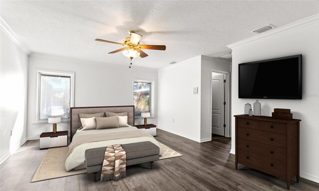 bedroom with ceiling fan, crown molding, dark wood-type flooring, and a textured ceiling