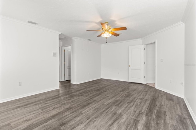 spare room featuring crown molding, dark hardwood / wood-style floors, and ceiling fan