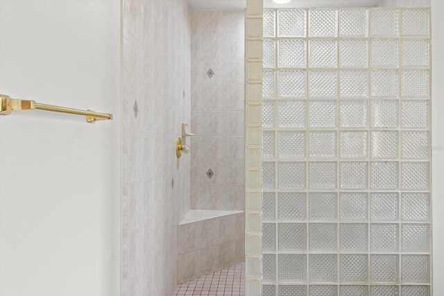 bathroom featuring tiled shower