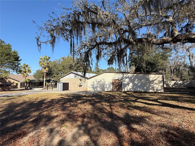 view of home's exterior with an outdoor structure