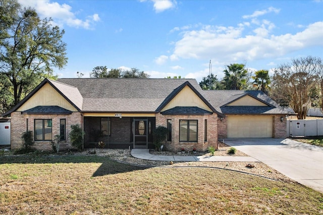 ranch-style house featuring a garage and a front yard