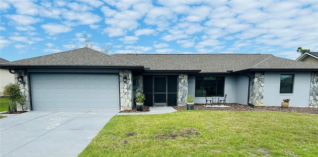 ranch-style house featuring a garage and a front yard