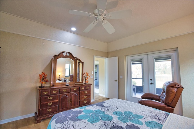 bedroom featuring french doors, ceiling fan, access to exterior, and light hardwood / wood-style floors