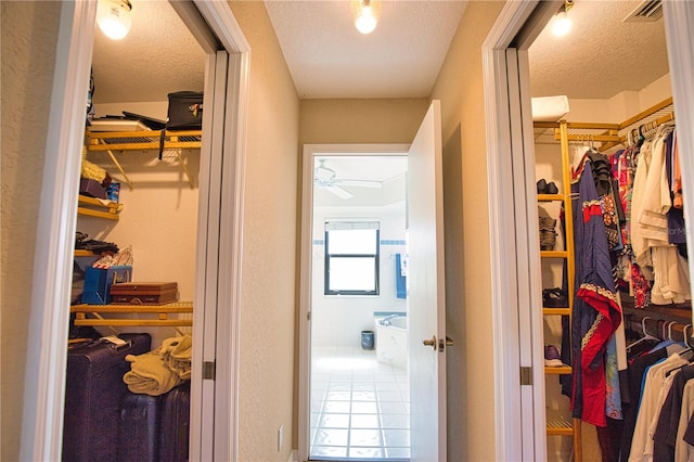 spacious closet with tile patterned floors