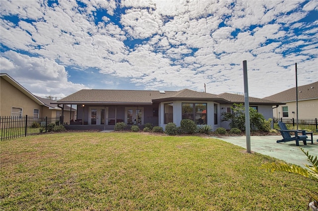 exterior space featuring a patio area and a front lawn