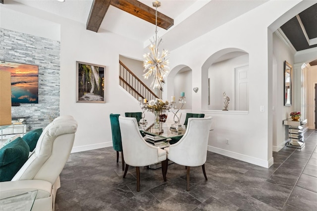 dining space with beamed ceiling and a notable chandelier