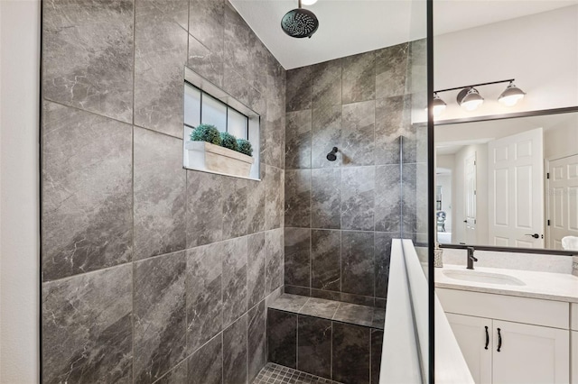 bathroom featuring vanity and a tile shower