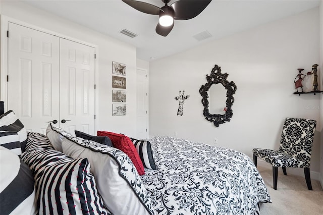 bedroom featuring ceiling fan, carpet floors, and a closet