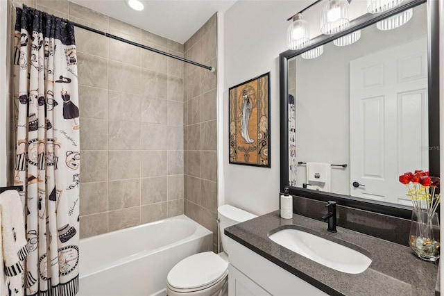 full bathroom with vanity, shower / tub combo, and toilet