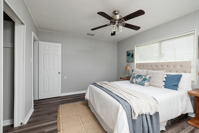 bedroom featuring dark hardwood / wood-style floors and ceiling fan