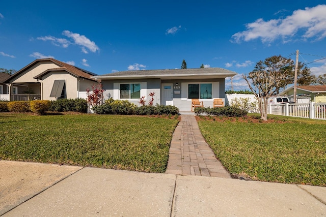 view of front of home with a front lawn