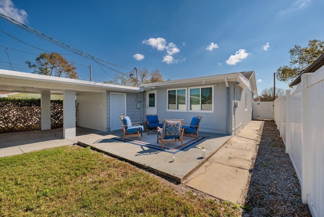 back of house with a yard and a patio area