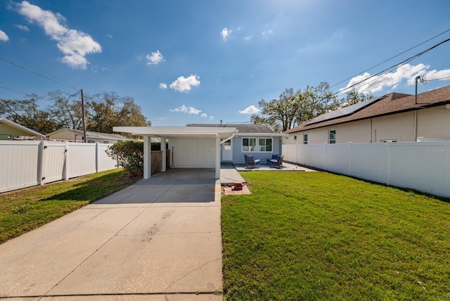 view of front of house featuring a carport and a front lawn