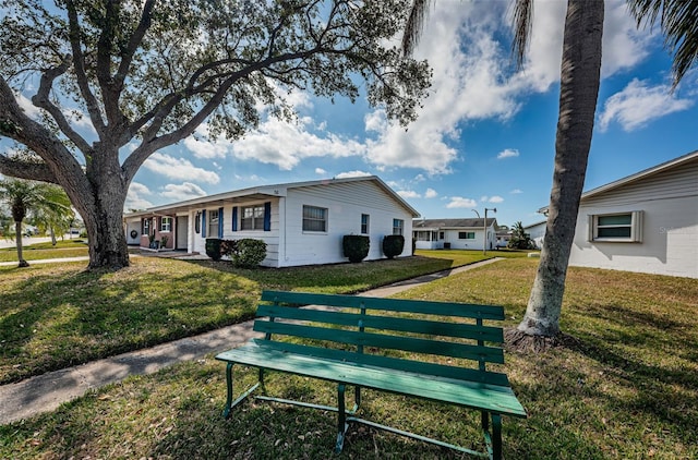 10022 Lily St N Unit N, Pinellas Park, FL 33782 - view of front of house with a front lawn