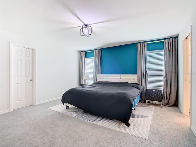 bedroom featuring carpet flooring and baseboards