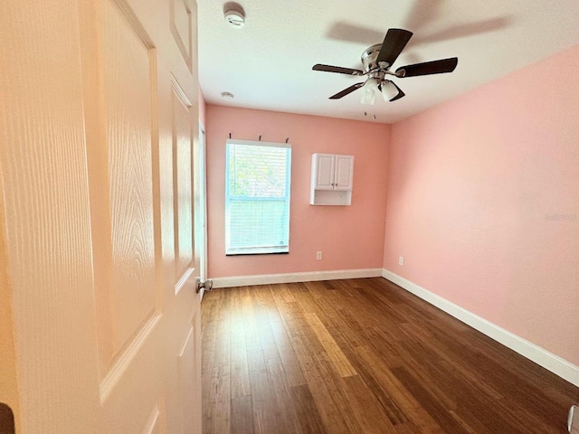 unfurnished room with ceiling fan and hardwood / wood-style floors