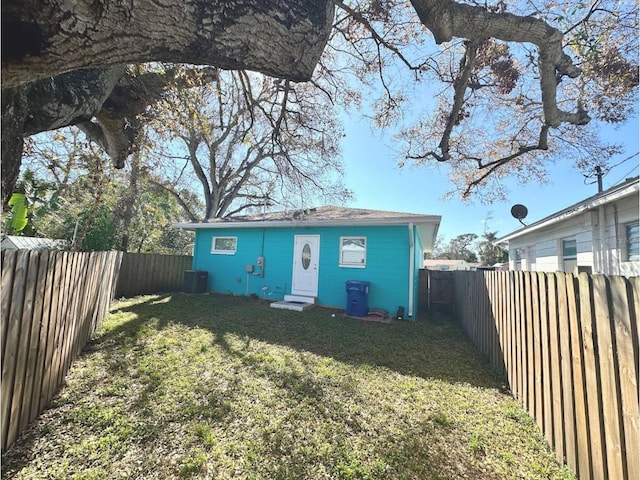 exterior space featuring a yard and central air condition unit