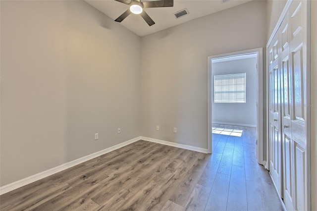 spare room with ceiling fan and light hardwood / wood-style floors