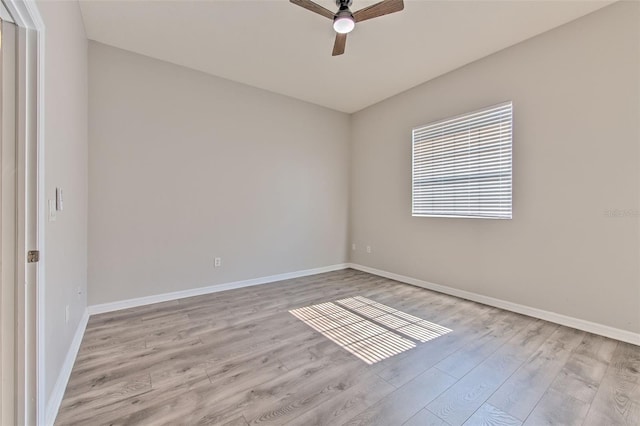 empty room featuring ceiling fan and light wood-type flooring