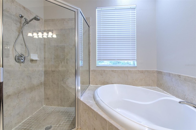 bathroom with separate shower and tub