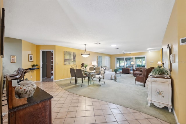 living room with light colored carpet and a textured ceiling