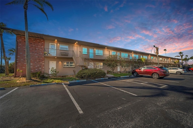 view of outdoor building at dusk