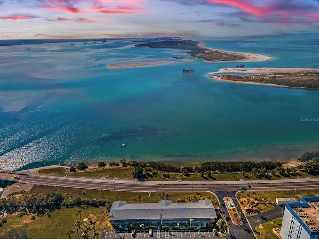 aerial view at dusk with a water view